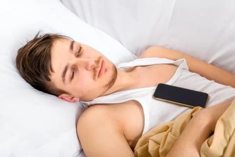 Sad Man in the Bed Stock Photos