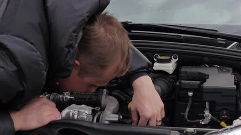 Sad man with broken car Stock Footage 70399058