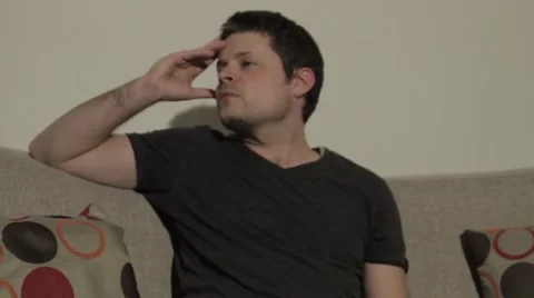 Sad Man on Couch 库存影片 40256163