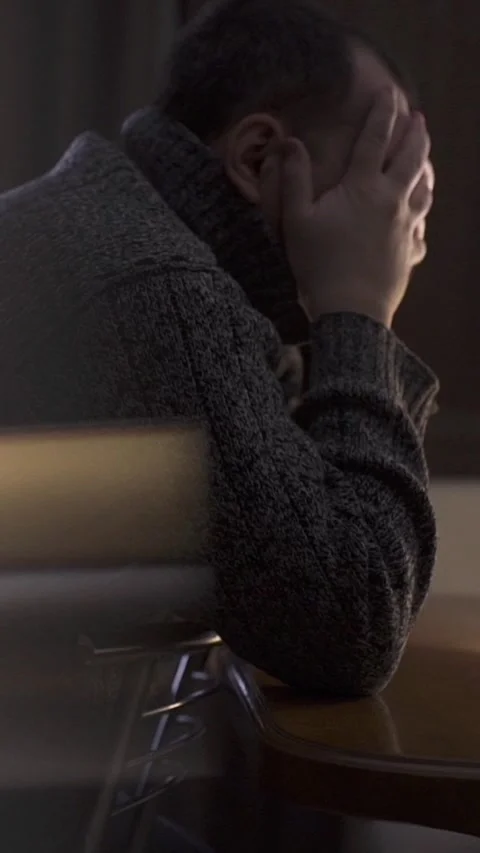 A sad man during a crisis. Concepts of depression, illness, and tragedy. Video stock 327851043