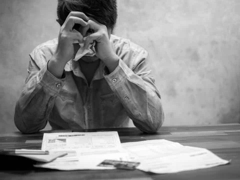 Sad man having financial problems with invoices and Credit Cards, Money conce Stock Photos