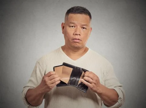 Sad man holding empty wallet Stock Photos