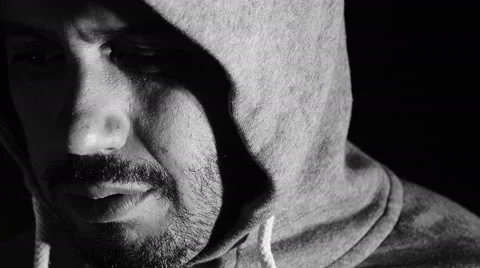 Sad man looking in the camera: hood, depression, darkness, loneliness Stock Footage 41769891
