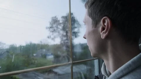 Sad Man Looking Through Rainy Window. Emotional Scene of Loneliness and Video stock 309209025