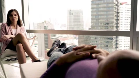 Sad man lying at couch and talking with therapist 스톡 동영상 99843186