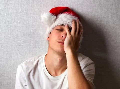 Sad Man in Santa Hat Foto stock