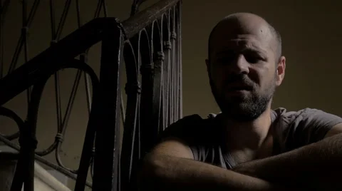 Sad man in the shadows, looking light 스톡 동영상 69016013