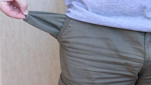 Sad man showing empty pocket Stock Footage 245411562