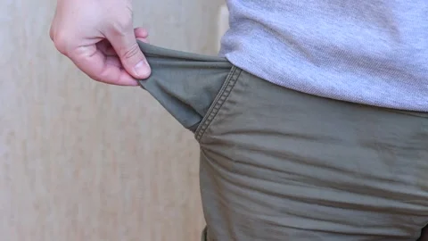 Sad man showing empty pocket Stock Footage 245411563
