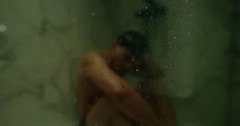 Sad man sit and cry inside shower in bathroom. Depressed alone guy feel grief. Stock Footage 338011039