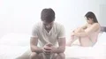 The sad man sit near the woman on the bed 4k or 4k+ Resolution