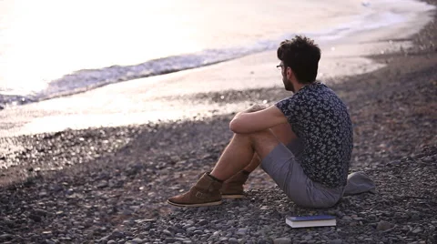 Sad man sitting on the beach.  Stock Footage 58248216