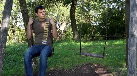 Sad Man on Swing 1 Stock Footage 49448301
