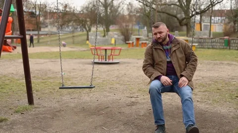 Sad man swinging and thinking about something Stock Footage 60962815