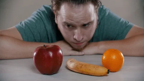 Sad man is taking out a cake on the table Stock Footage 118472931