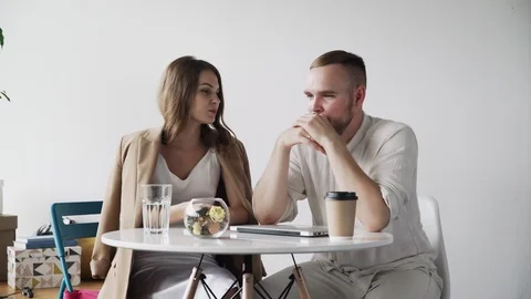 Sad man talking with a beautiful female ... | Stock Video | Pond5