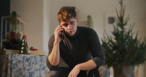 Sad man using smart phone at home Video stock 259062284