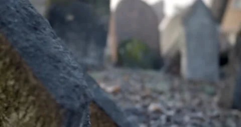A sad man walks through the old Jewish cemetery in Prague Stock Footage 139499317