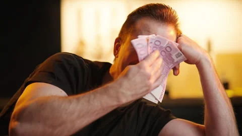 Sad man wipe tears with stack of euro money sarcastic meme 4K Stock Footage 261982855