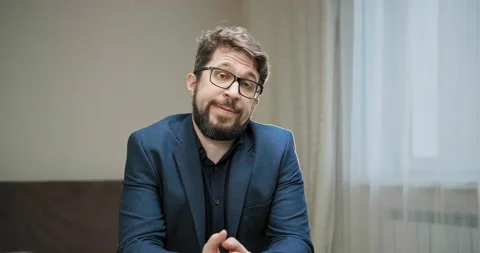 Sad manager with beard and glasses listening to chairman Stockbeeldmateriaal 146567977