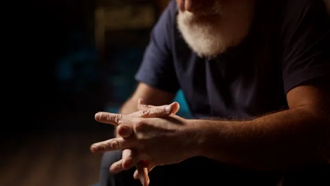 Sad middle-aged man cries alone at home, struggling with depression and grief Stock Footage 342520618