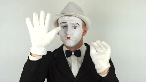 A sad mime shows tricks Stock Footage 86193947