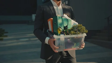 Sad office worker man stand look around with box of personal stuff lose a job Stock Footage 129462795