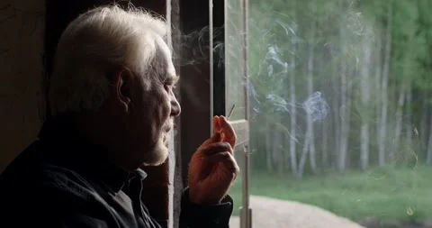 Sad old gray haired man smokes cigarette, sorrow and sadness of the old man, 4k Stock Footage 168175126