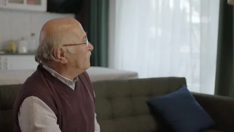 Sad old man with glasses is alone at home. Stock Footage 190692926
