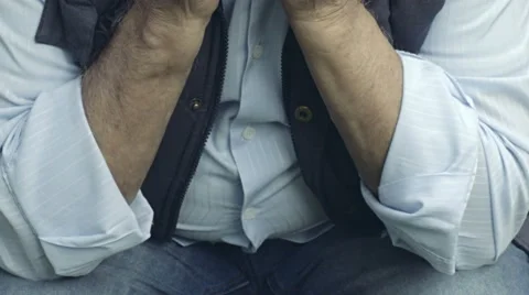 Sad old man sitting alone and deep in his problems: tilt portrait  Video stock 68749888