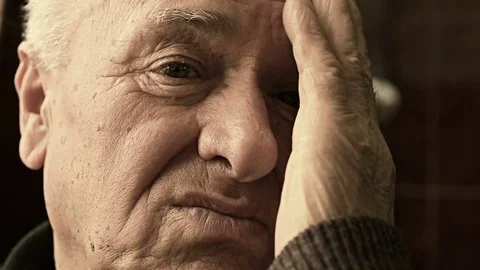 Sad old man standing alone and pensive about his problems Video stock 69992845
