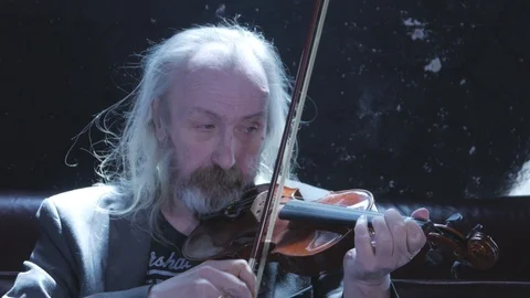 Sad old man on violin Video stock 111563137