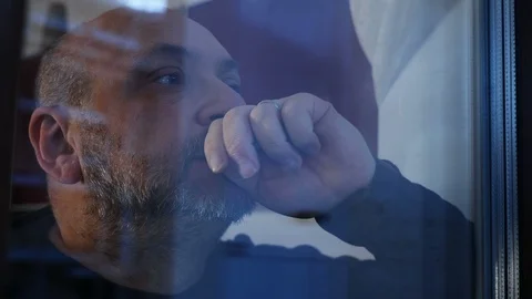 Sad pensive bald man at the window- close up Stock-Footage 91825792