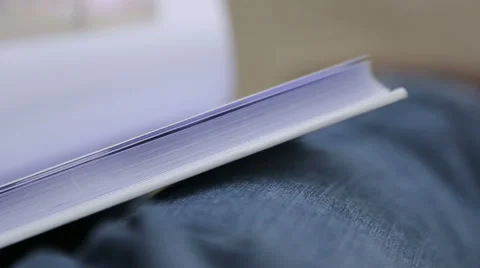 Sad pensive man considers the photo album, close-up Stock Footage 44444926