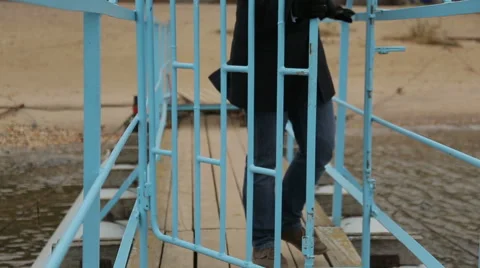 Sad pensive man opens the gate Stock Footage 44444687