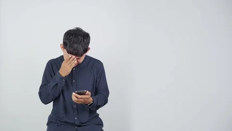 Sad Person Looking Down at Smartphone Vídeo Stock 344831029