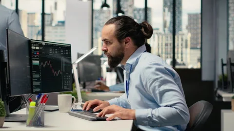 Sad portfolio manager in office dejected by negative investment returns Stock Footage 315153026
