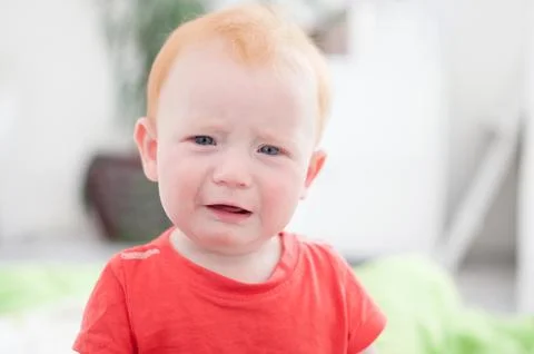 Sad redhead boy Stock Photos