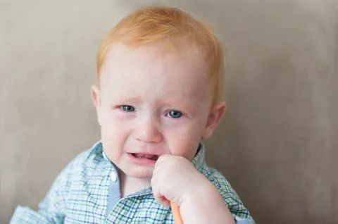 Sad redhead boy Stock Photos