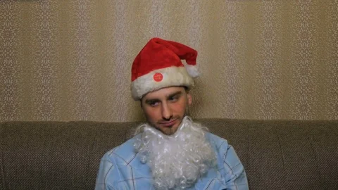 Sad Santa Claus in a fun Hat Stock Footage 84588767