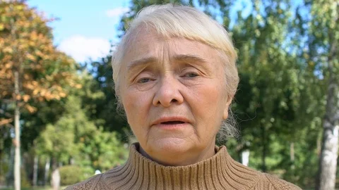 Sad senior lady looking camera feeling sorry, regret expression, disappointment Vidéo 118991329