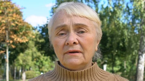 Sad senior lady looking camera feeling sorry, regret expression, disappointment Stock-Footage 119011692