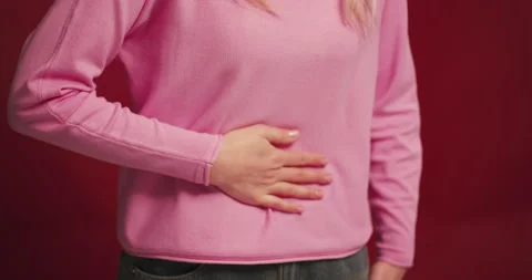Sad, sick blonde middle aged woman having stomachache, spasm feeling bad Stock Footage 321550972