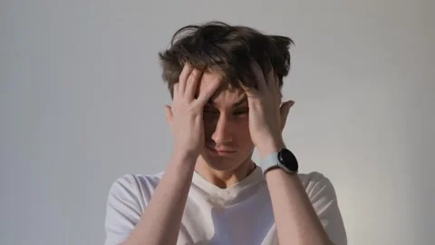 Sad sleep-deprived guy on isolated background Stock Footage 283401163