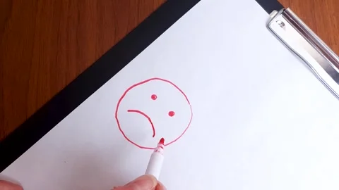 Sad smiley face drawn in marker. Mental health smiley face. Stock Footage 302377256
