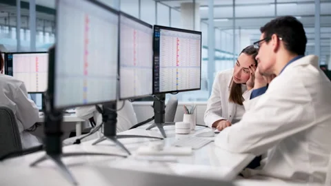 Sad Stressed Doctors In Hospital Using Spreadsheets Stock Footage 329297418