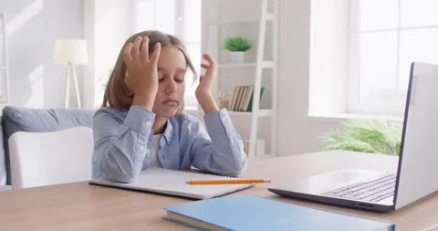 Sad, stressed, frustrated child with learning difficulty is doing school Stock Footage 316782159