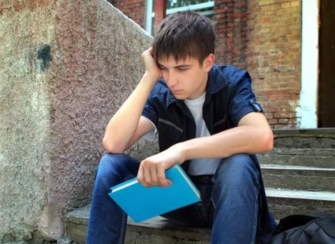 Sad Student with a Book Stock Photos