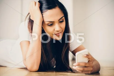 Sad teeange girl video messaging mobile phone Stock Photos