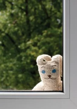 Sad toy rabbit outside Stock Photos